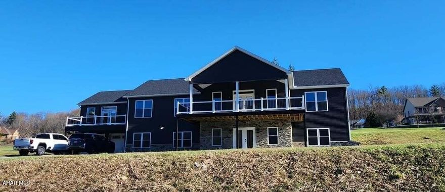 Welcome to 304 Clearview Drive, with just over 5,000 finished square feet of living space. This spacious and beautifully designed 5-bedroom, 3.5-bathroom home offers comfort, functionality, and incredible views of Scotch Valley. The upper level features an impressive great room with vaulted ceilings, an open-concept layout, and a deck that perfectly captures the scenic surroundings. The luxurious primary suite offers a private balcony, spa-like ensuite with a jacuzzi tub, and two walk-in closets. You'll also find two generously sized bedrooms connected by a Jack and Jill bathroom, a flexible bonus room ideal for any use, a private office with French doors, and a convenient laundry room. The kitchen offers beautiful granite and a large island. The main level is perfectly suited for guests or additional living space featuring a welcoming entry, full bathroom, kitchenette, large recreation room, two additional bedrooms, and a utility room. French doors open to a beautiful outdoor patio. Call listing agent for your tour.