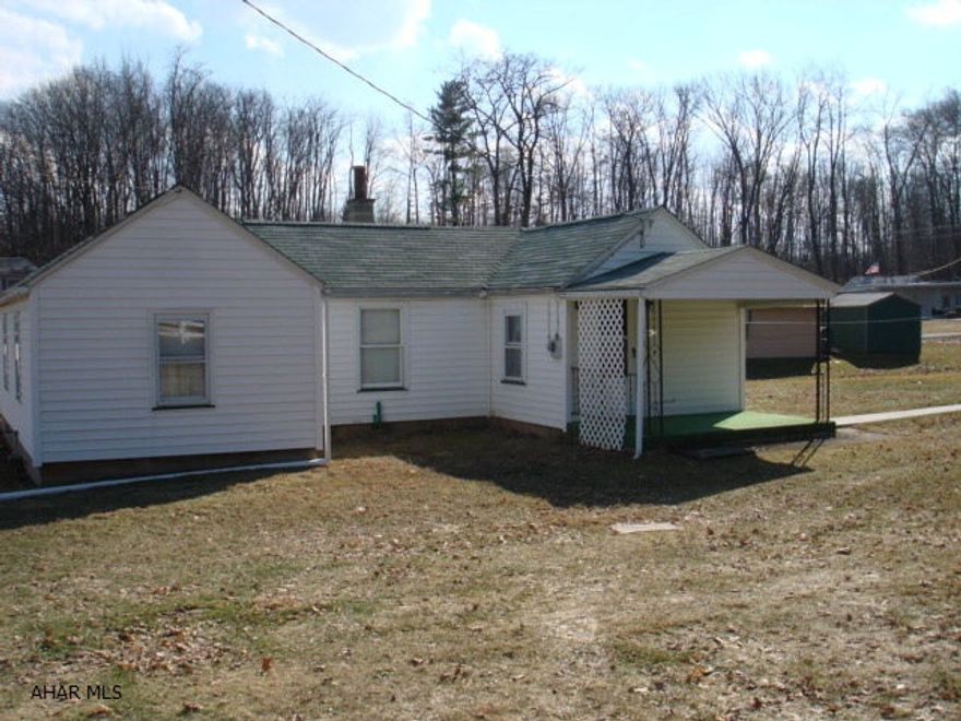 Cozy two bedroom home on .72 acre of land.  Two and a half car detached garage.