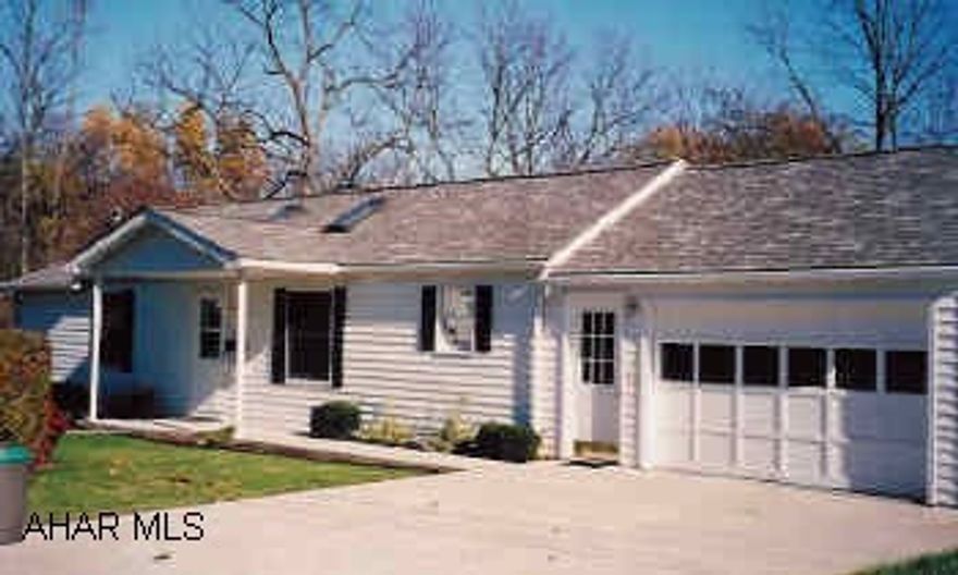 4 bedroom vinyl ranch home with attatched 1 car garage.  Nicely kept ranch conveniently located just outside town. Features full basement with game room and new carpet throughout.