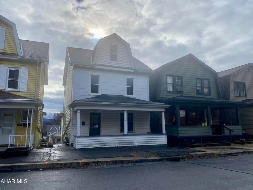 MOVE IN READY!! This house has just been renovated and is ready for YOU! Brand new vinyl flooring throughout, fresh paint throughout, new refrigerator and dishwasher. The first floor has a separate living room, dining area, bonus room that can be used as a pantry or office, kitchen and half bath. Upstairs you will find three bedrooms and a full bath. The attic could be used as a bonus room, complete with heat. Outside you will find a fenced in yard and a covered porch area that is perfect for entertaining. Off street parking is in the rear of the home where you will find the garage. New carpet is being installed on the front porch. Dont miss out!