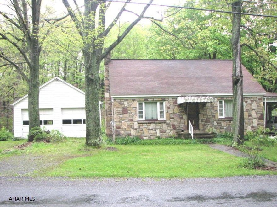 Nice lot, 1.6 acres, stream in rear. 4 bedroom, 2 bath, carport plus 2 car garage & shed. Hardwood floors. House needs work. Sold As-Is.