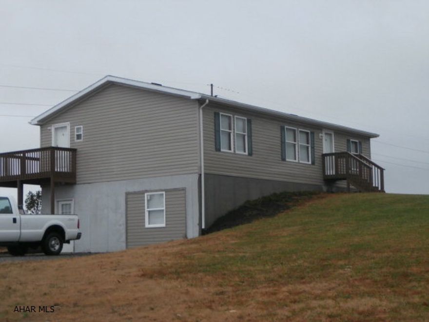 Double wide on 1.5 acres. Great view and country setting near St Augustine. Full finished basement with 4 rooms and furnace room. First floor has nice kitchen, dining area, living room, laundry and 1.5 baths. Clean and well maintained. Gas rights included.