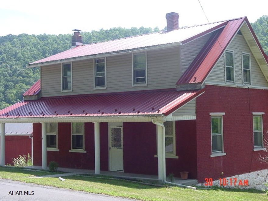 This two story home boasts American Chestnut woodwork throughout with a spectacular view from the spacious back porch! It's country living at its best. The home has a new metal roof, vinyl siding, bathroom updates, complete new chimney for wood burning furnace, and many more updates. The home is not only a buy on the inside, but for the outdoors men as well. The home is located only 15 minutes from Weaver Falls boat launch into Raystown Lake, and minutes from tens of thousands of State Game Lands. Yellow Creek is famous for trout fishing in Pennsylvania, and is located only 75 yards from the property.