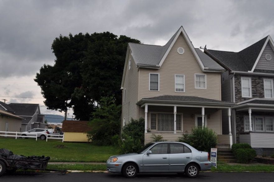 GREAT LOCATION THE EXTERIOR OF THE HOME IS UPDATED VINYL SIDING REPLACEMENT WINDOWS. CLOSED IN BACK PORCH EXTRA LIVING SPACE. UPDATED WIRING. INSIDE NEEDS WORK BUT WITH A LITTLE WORK THIS WOULD MAKE A GREAT HOME. HARDWOOD FLOORS UNDER THE CARPETING.