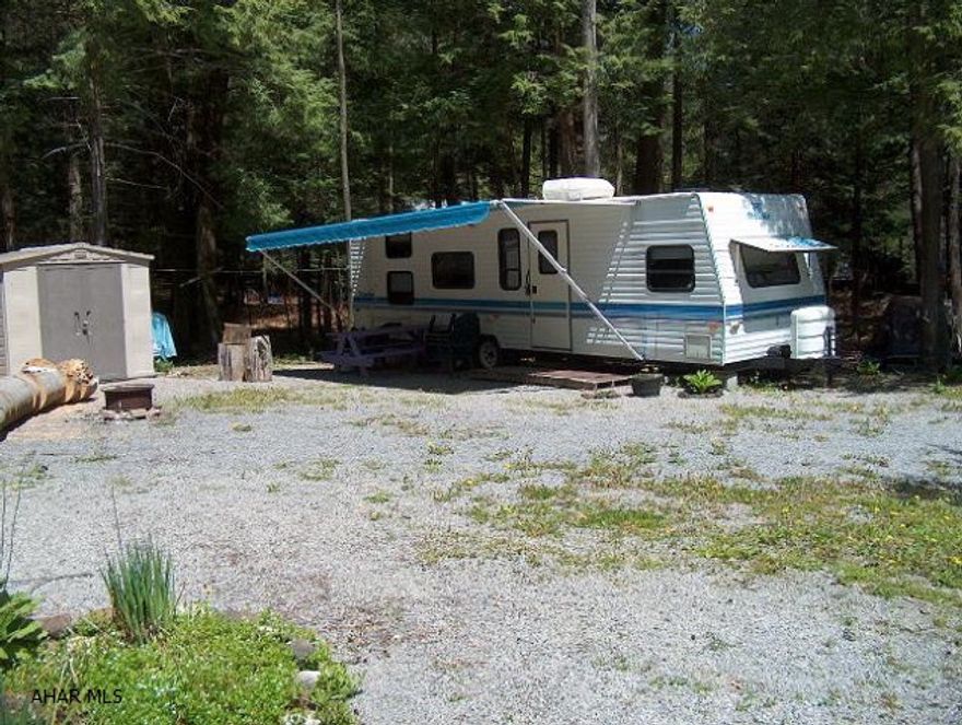 Beautiful 1996 Prowler camper on level lot. This is a must see!