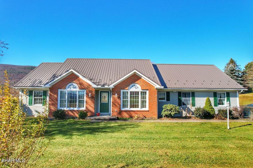 Immaculate 4-bedroom 3 bath home on 2.40 acres surrounded by lovely panoramic country views. 

This home offers a large Livingroom with a beautiful built-in entertainment center. 
Large eat in kitchen with an abundance of cabinet space.

Office and dining room are directly located off the foyer. 

Primary suite includes a master bath and walk-in closet. 

An attached two car garage, 32'x48' building and private back patio with panoramic views complete this lovely property.