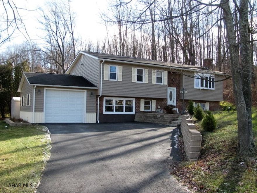 Spacious Brick & Vinyl Bellwood Bi-level!! Conveniently located just 15 minutes from Altoona and 30 minutes from State College with easy access to I99!! This home offers a Lg LR w/fireplace and bay window, EIK w/Ceramic tile flr and stainless appliances, 3 bedrooms plus a LL family room space and 2 bonus rooms! Newer roof, siding, windows and furnace!!