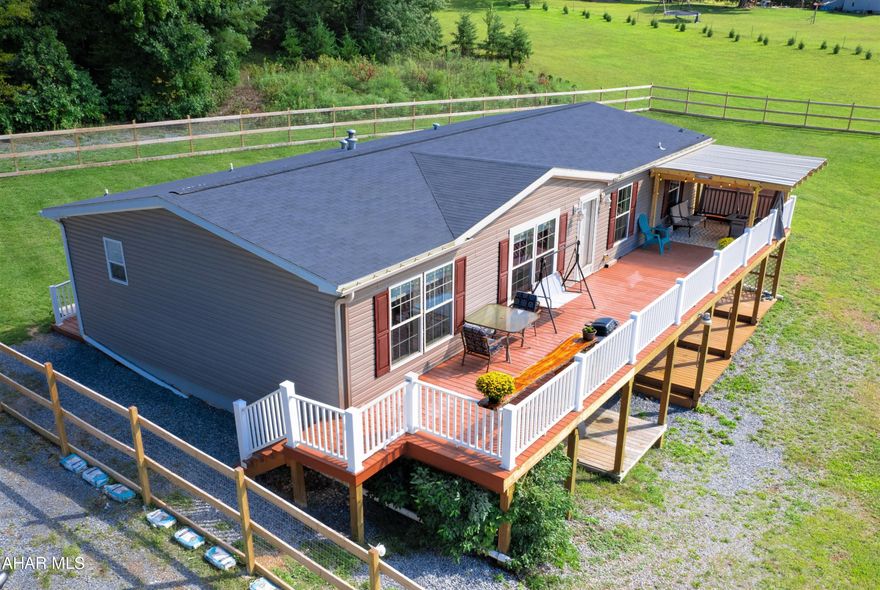 Absolutely beautiful and well-maintained double wide home resting on 7.91 scenic acres. This home offers a large living room open to the kitchen and dining room, owner's bedroom suite with full bath, two additional bedrooms with another full bath, and a first-floor laundry room. Full walk-out basement that would be perfect for future finishing. Heat pump with oil back-up and central air conditioning, private well and private septic system. Huge rear deck for entertaining, relaxing, or just enjoying the expansive country views. Large shed for all your toys or future workshop. Expansive fenced area and modern-day chicken coop on site. Just a short drive to Buchanan State Forest, the MD/PA border, Rocky Gap State Park and Green Ridge State Forest.