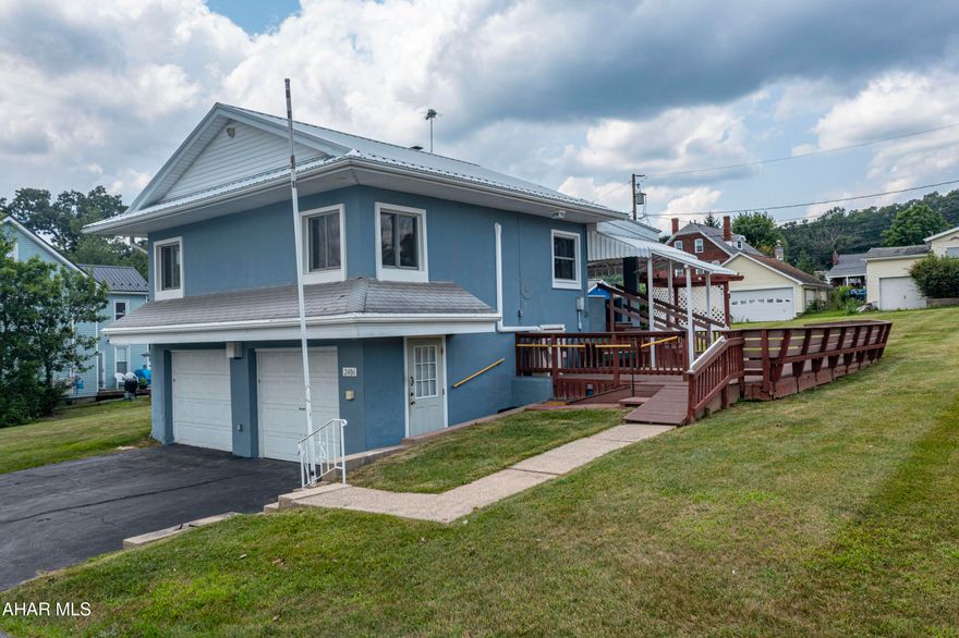 Nestled on a spacious 0.41-acre corner lot in Altoona's Westfall neighborhood, this charming one-bedroom home offers a rare combination of privacy, functionality, and convenience. Recently refreshed with new flooring and paint throughout, the home features a large deck ideal for relaxing or entertaining, a 10x20 workshop, and multiple sheds for storage or creative projects. A two-car garage ensures ample off-street parking. Located just steps from dog-friendly Westfall Park—with its scenic trails and fenced-in baseball field overlooking the Allegheny Mountains—this home is perfect for outdoor enthusiasts. Whether you're a first-time buyer, downsizer, or seeking a low-maintenance property with room to expand, this inviting residence offers a peaceful lifestyle close to parks, local amenities, and downtown Altoona.