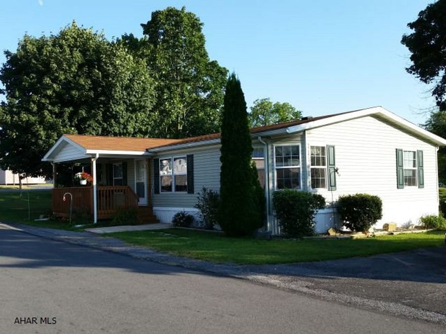 Seller updated the kitchen appliances and added covered porch and deck, new shutters, storm doors, new linoleum to kitchen and baths, replaced living room carpet, added 2 new toilets, landscaped and added decorative stone walkway. 2001 Skyline, vinyl sided, 3 bedroom, 2 bath, doublewide w/vaulted ceilings. Has central air and kerosene forced air heat.  #J-304