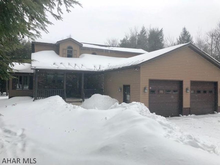 You will love this bright and spacious home nestled amidst 33.9 wooded acres.  When you first walk in, you will feel at home with natural light filling the kitchen and living areas.  First floor master includes large walk-in closet and a "spa experience" master bath with custom vanity, stand alone shower and heavenly soaking tub.  No expense was spared when it comes to the custom woodwork throughout the house.  If you are one who enjoys the outdoors, than you have just found home!  This property is just minutes away from Blue Know All Seasons Resort and adjoins State Game Lands #26.  Over 30 miles of walking, ATV and snow mobile trails are accessible right from the property.  Outdoor deck and patio with several outbuildings .  A truly wonderful property that is sure to impress!