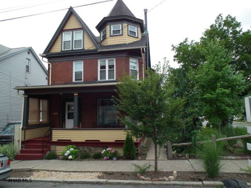 Three story home on double corner lot, full of charisma on every level.  Conveniently located near campus & downtown.  This 3 bedroom, 2 bath has a dining/breakfast area, formal dining room, & living room with stained glass adding to it's appeal!  Each has hardwood flooring & there are pocket doors between dining & living room.  Updates include:  kitchen, electric, & replacement windows.  Exterior has garden area for relaxing & both a front & back porch.  Call today to view or for more information.