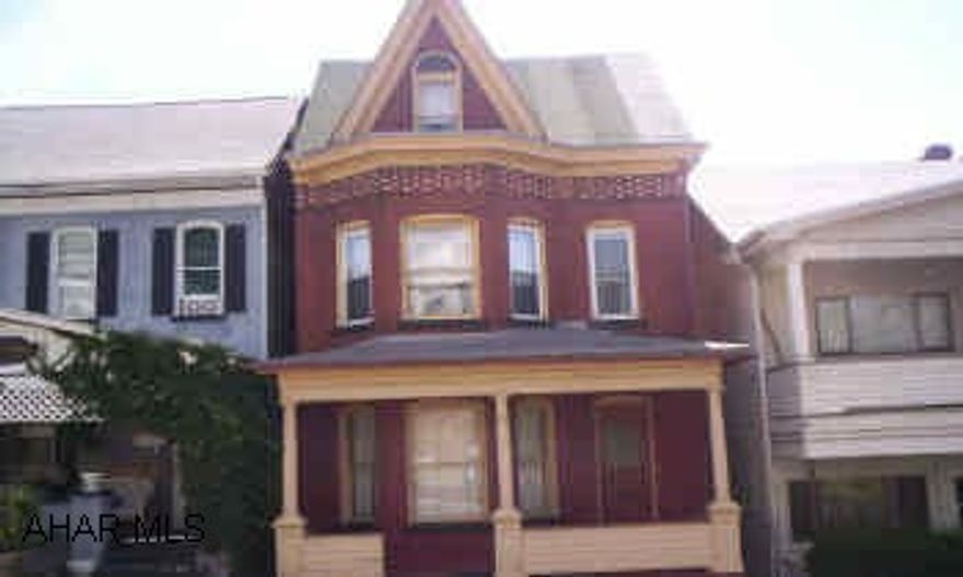 Brick needs some repointing, some soffit fascia work. Natural woodwork on 1st floor.