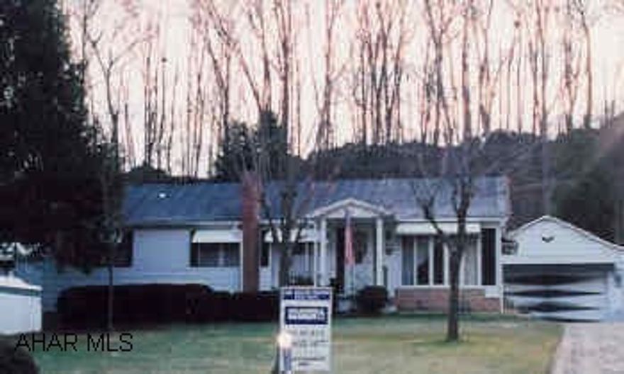 Well kept modular with swimming pool, 2 car detached garage, newer kitchen and fireplace.