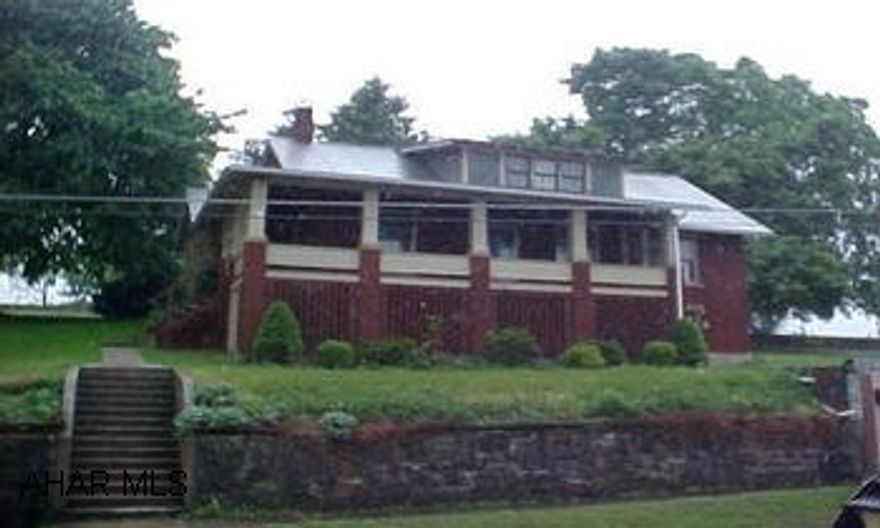 Rt 36 S, Right after Northern Bedford School, Left into New Enterprise, Right at Stop - Home on Right.  Brick Home with 1-Car Garage priced to sell.  Nice Backyard and Deck, Wraparound Porch.  In South Woodbury Township  #J-808 Home with 1-Car Garage priced to sell.  Nice Backyard and Deck, Wraparound Porch. In South Woodbury Township #J-808