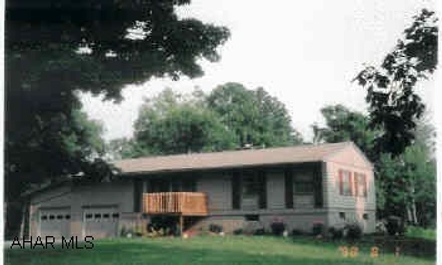 Nice Ranch Home with 3 Bedrooms, very pleasant location. Hardwood floors, newer furnace and roof, well taken care of. 900 walnut trees, 3 yrs old. Outbuildigs, mature trees, 2-car attached garage with propane.