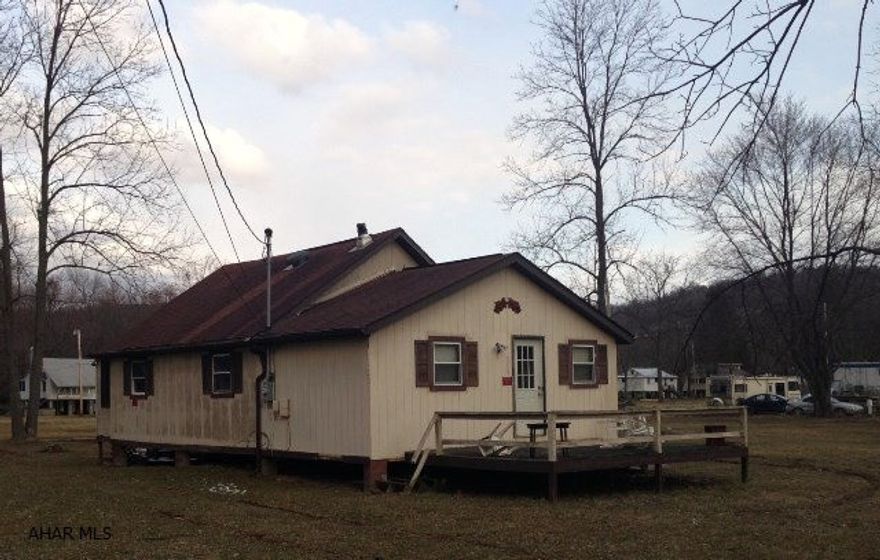 Cottage for summer get-aways or year round living. Located in beautiful Camp Sunshine. Property includes 4 lots that total 0.77 acres. One with an unused, separate well. Two bedrooms plus a loft that could serve as a 3rd bedroom. Needs a little TLC but could easily be ready for summer!