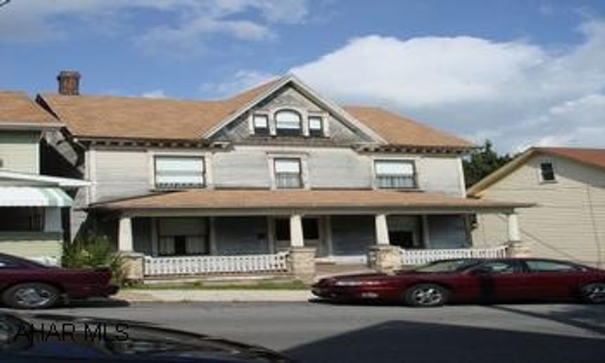 5 bedroom home with garage.  Sits on double city lot.  Needs work and updates.