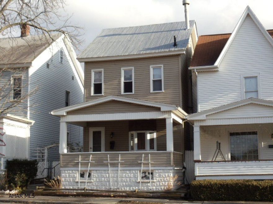 Nice vinyl-sided home across from Altoona Area School District Community Education Center.  1+car detached garage.  Breakers.  Fenced back yard. #J-112