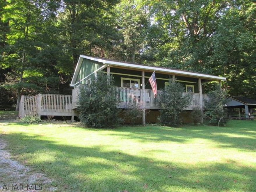 Terrific property along the Juniata River! Kitchen features a large center island, plenty of cabinets, and all appliances. Spacious living room that draws plenty of natural sunlight. Lovely open floor. Beautiful knotty pine cathedral ceilings give this home a warm and rustic feeling. Detached 2 car garage will provide tons of storage. Huge partially finished loft above garage. Loft could be additional bedrooms or man cave. Enjoy the river view from the wrap around deck. Minutes away from country club and golf course. Walk your kayak down to the river or dock your boat in front of the property. Fishermen will love the top-notch smallmouth bass fishing on the river! Here is your chance to own a rare and unique property!