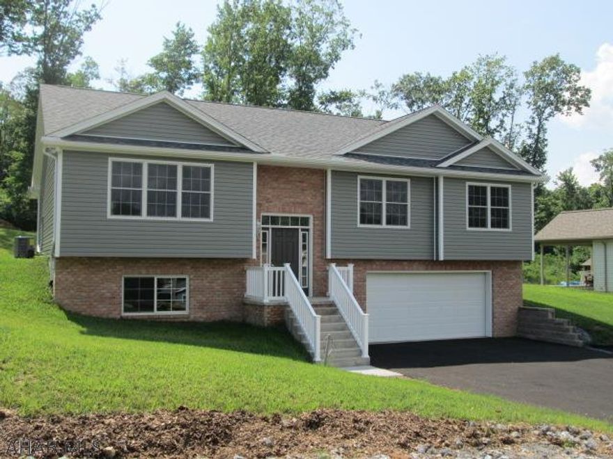 Logan Township's newest development, Lakeview Estates. This new construction features 2300 square feet of living space. Vaulted ceilings are featured throughout this spacious 3 bedroom with 3 full bath home. The finished lower level has a full bath and spacious laundry room. The oversized garage measures 29' x 24'. Still time to pick your flooring and lights. If you are looking for a remote and quiet location in Logan Township, this is it!  The H.O.A. fee is $150/Year and takes care of the street lighting and maintenance of the retention pond.