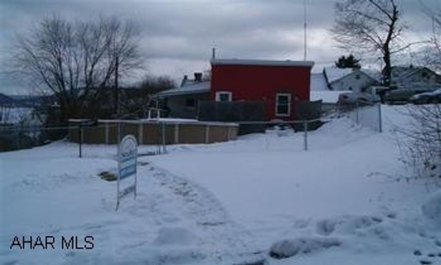 Updated home with good mechanics and move in ready. Large master bedroom, rear deck, pool and garage. Very well maintained 2 to 3 bedroom house with 2 (50x120) parcels. City plows alley. 2 Tax ID numbers. 1-1-2-180 and 1-1-2-179