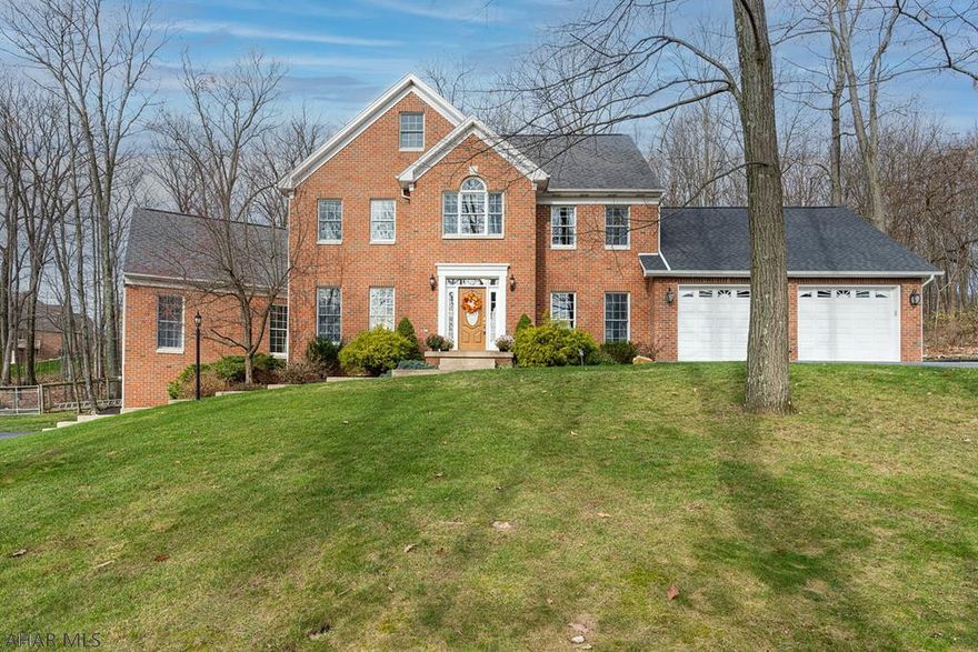 A luxurious home in Stonehedge, over 5,000 square feet of living space, featuring five bedrooms with one located on the first floor which is handicapped accessible from the oversized two car garage. The kitchen was upgraded by replacing the cabinetry, expanding the center island, adding quartz countertops, installing double ovens, along with a five-burner stovetop. Step out from the kitchen to a Trex wrap around deck and a sunroom.  Hardwood floors throughout the first floor were re-finished and remainder of the home was re-carpeted. The spacious and bright family room features a Southern exposure, vaulted ceilings and a gas fired fireplace (to take the chill off on those cold winter nights).