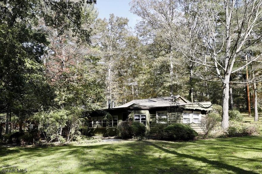 Want to enjoy a quiet life on the river, then don't miss this charming home. Much bigger than it looks. Sun porch overlooks the river. Mudroom, laundry room then enter the family room with a wood stove for warmth on those cold winter nights. Formal living room. Dining area, office area, kitchen. Three bedrooms and full bath. This truly must be seen to be appreciated. Landscaping with lots of perennials. Call now. Can be a full time living or a vacation home.