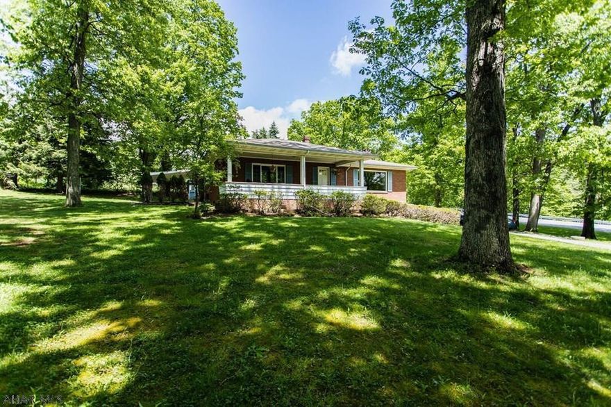 Location! Location! Location! Beautiful 4 bedroom, 1.5 bathroom house situated on over an acre of land. This house features stunning hardwood floors throughout, fresh paint, and a large yard. Enjoy the covered front porch or cozy patio with family and friends.