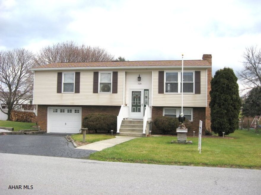 Immaculate 3 bed. l.5 bath  bi-level in the borough of Martinsburg. Updated kitchen with eating area. Finished lower level with woodburner,new ceiling.   Large deck 16x12 with awning and storage underneath. Nicely painted throughout, carpet like new. 1 car garage with additional parking.