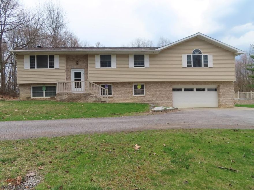 Very Nice Home on 6 acres. 3 Bedroom Bi Level with finished basement and built in 2 car garage. This home it set up to entertain with a nice kitchen and walk out patio down to the pool, yard and fire pit. Its great place to enjoy your nights out side. When it gets cold out there is also a great space in the basement with a finished den and rec room with bar and bathroom.