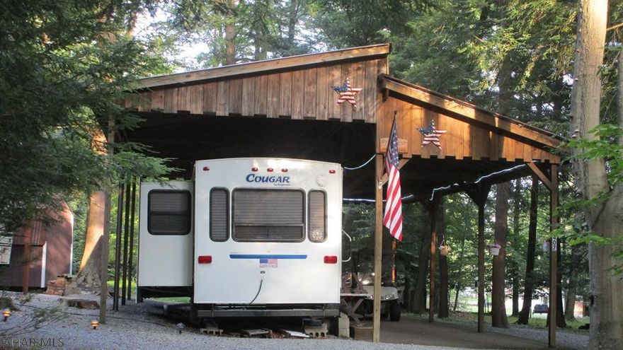 Looking for a great get-a-way in a private camping area?  Nice pavilion covered camper in a quiet area.  Central air.  Golf cart included with a full price offer.  Adjacent property is also for sale if you have family or friends you would like to camp near.  Located in Glendale Yearound, a gated recreational community adjacent to Prince Gallitzin State Park / Glendale Lake.  Six miles from Rock Run ATV Park.
