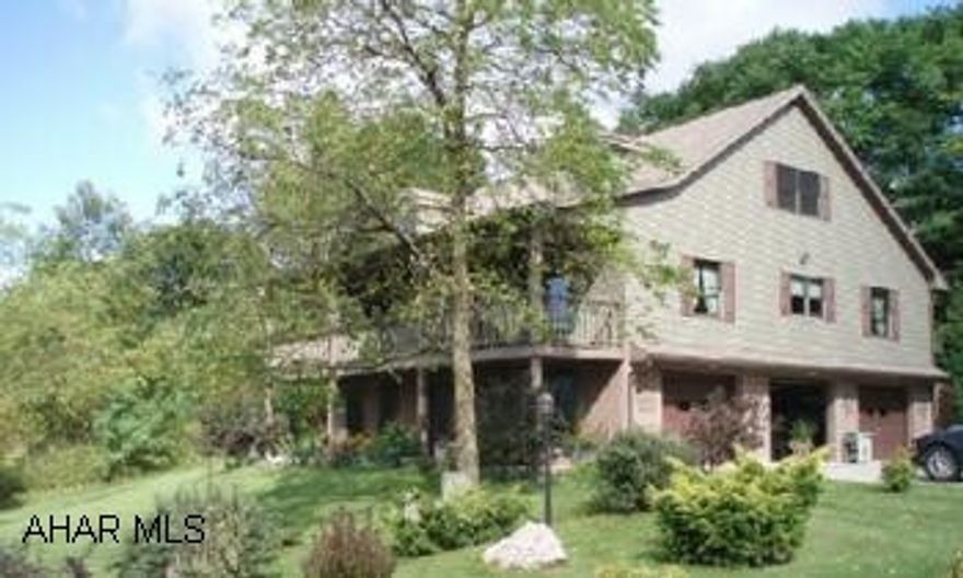 Large Cape Cod with first floor laundry room and bedrom and his & her bath