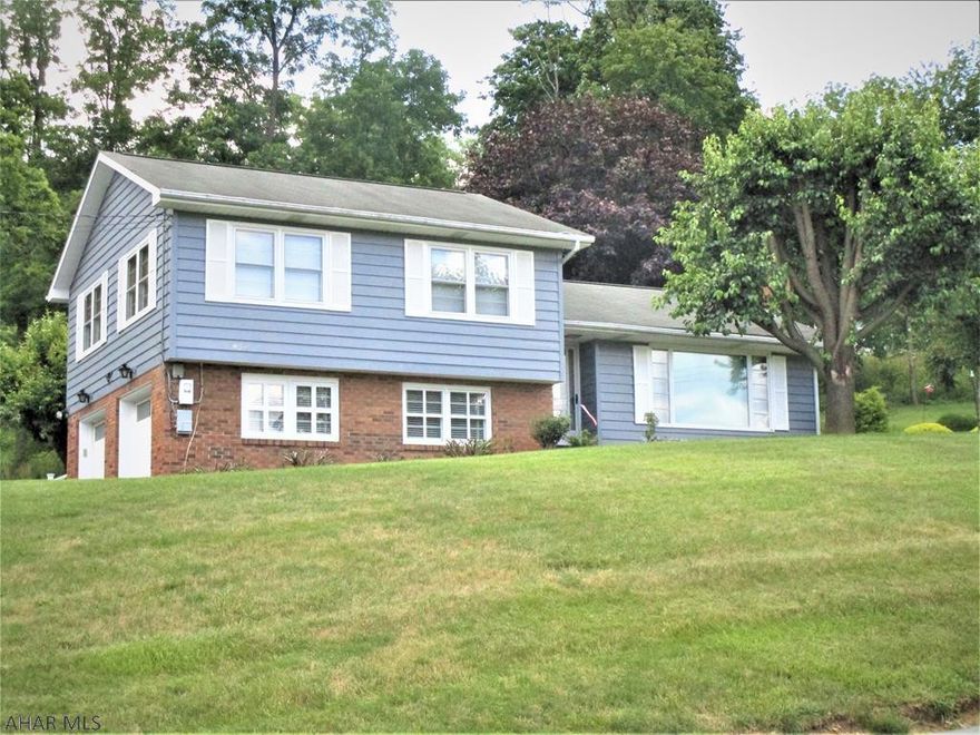 Nice home on lg. lot!  Multi-level:  Living, dining rm.,, kitchen & sun/Florida rm. level;  the 3-Brm. & 1 bath level;  the basement family rm;  & bath levek; &, the 2-car int.l garage level. Oil hot water basebd heat; 1,000 gal. undergd. tank (ft. yard). . Central air.  Fireplace (set up for propane gas). Public water & public sewer. Included: Wind. .treat's; dehumidifier; washer/dryer;cooktop; wall oven; dishwasher.;   Great location & seasonal views.