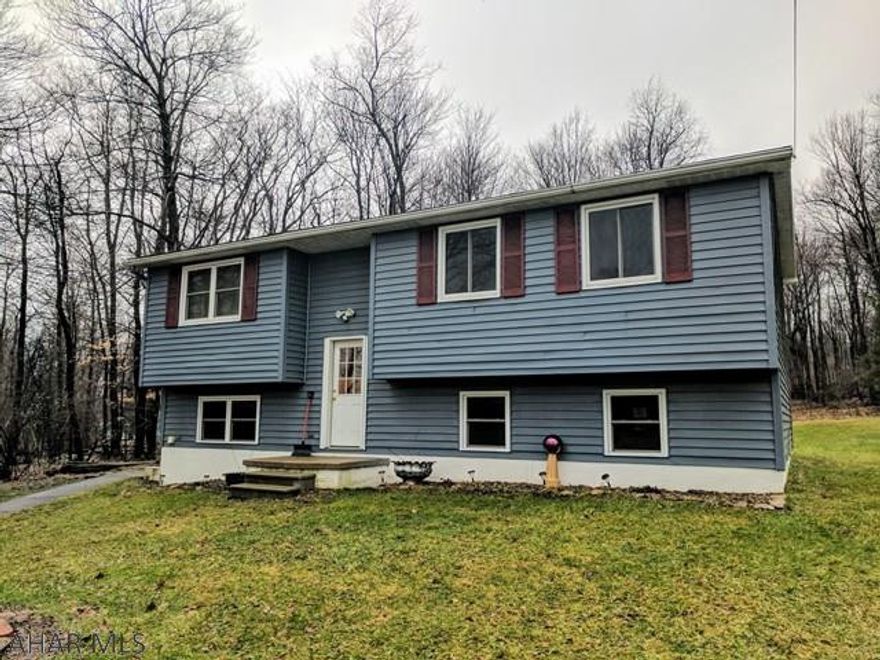 Move right in to this completely remodeled bi-level home. The home is set back, off the road, for privacy and features a spacious backyard, surrounded by trees. It features 3 bedrooms and one full bath with new carpet & flooring throughout.  There is radiant heat in the bathroom floor & ceramic tile in the shower/tub. Windows & doors feature custom pine wood trim, stained and sanded. There is also a custom pine wood decorative wall in the living room that includes removable shelving. The basement is partially finished with a large rec room and additional storage. There is also a large back deck made of prime treated lumber that features two sets of stairs leading down to the backyard. It's a great place to sit and enjoy the wildlife, as you sip your morning coffee or grill out.