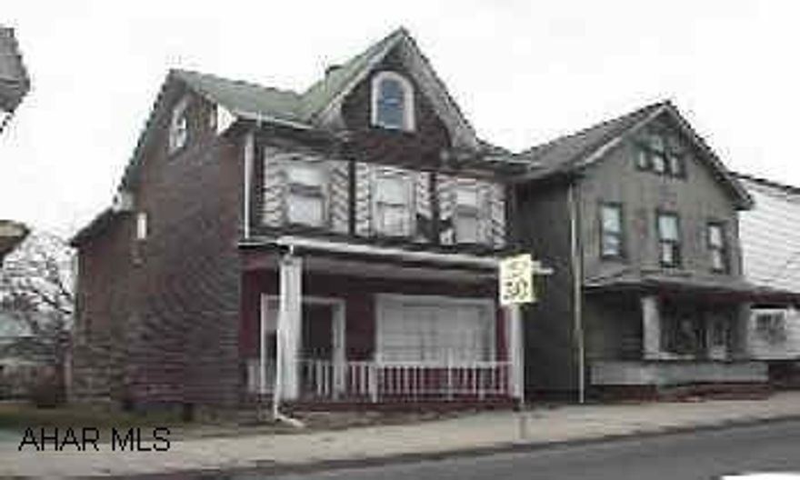 Large home with 3-4 bedrooms, 2 full bathrooms, attic.  Needs work.