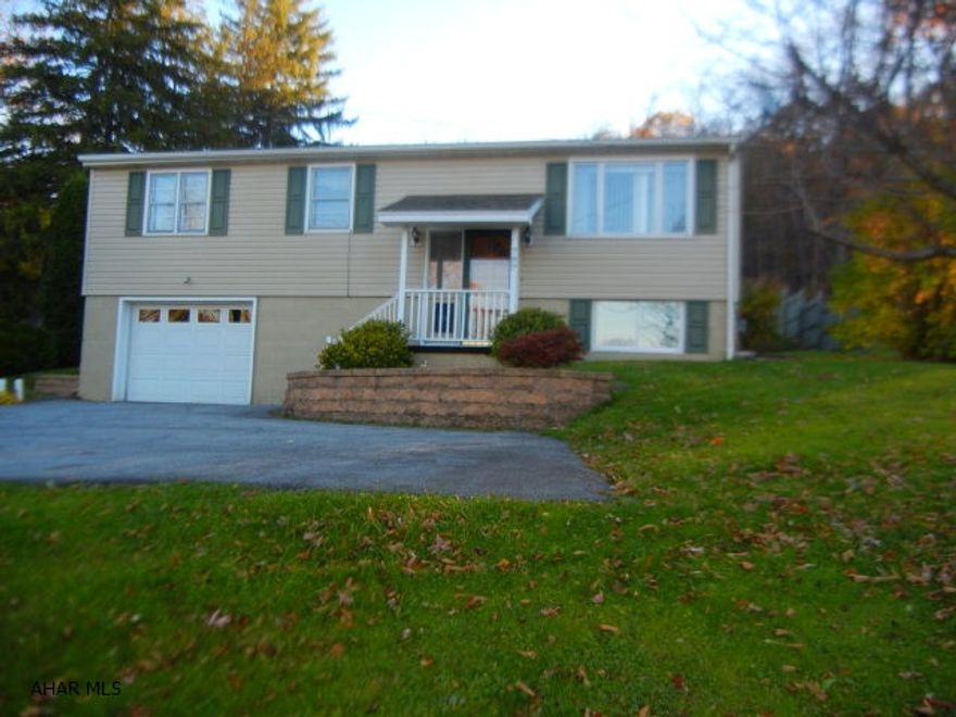 Well maintained, quality split entry home.  Access rear parking area from drive to left of garage/parking area.  Priced below appraised value.  Solar lights in kitchen and main bath.