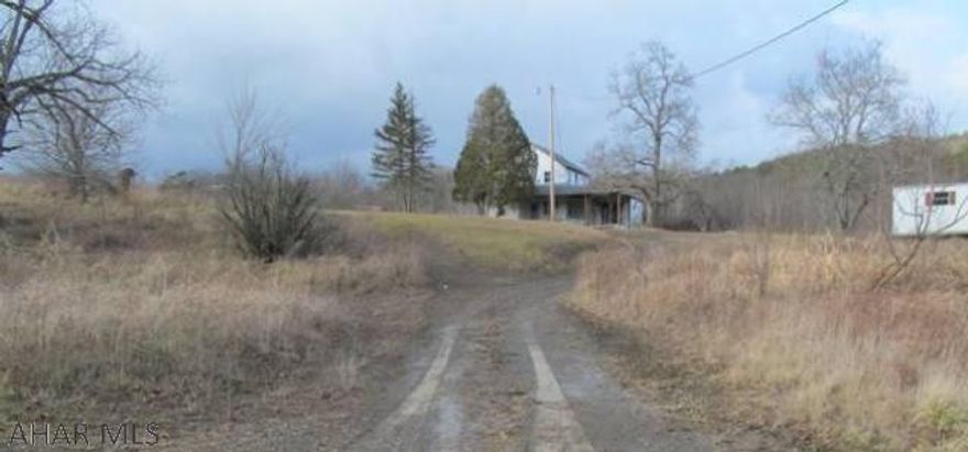 27 + acres- Land only. Rural Semi- private location. Would make a nice individual home building site or farmette. Underground Springs make a pond possible. As is: hunting camp or recreational use. House is NOT habitable.