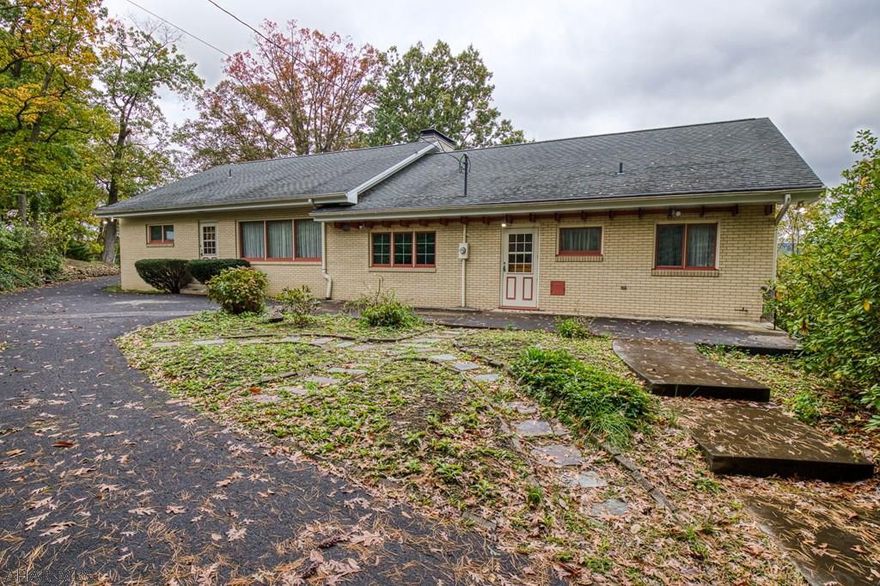 1 story brick home in the Beverly Hills area. This 3 bedroom, 2.5 bath home has large living room with stone face brick, F/P-wood burning. Dining Room has beautiful hardwood floors with kitchen buffet area. Kitchen is spacious with hardwood floors and canned lighting, double oven, stove top and microwave, 1/2 bath in hall area from kitchen, walk in cedar closet in hall. Master Bedroom and bath, 2 bedrooms on other side of home with full bath accessible from 1 of the bedrooms. Large basement adds to family fun (will need refinished), commode in basement and sink hook up is there. Bonus room off main area in basement, F/P in basement. 3 car garage with storage, screened in patio 8'4x4'1 color stone flooring-nice view. Pulled down attic is finished and was used as bedrooms by prior owner.