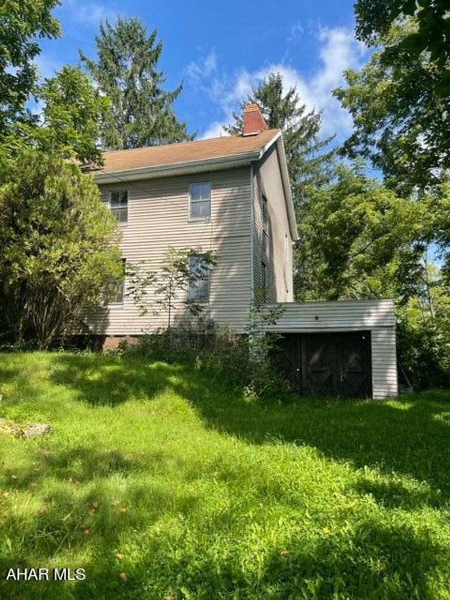 Very nice 1 acre+ lot in Geeseytown area of Hollidaysburg... with a 3 Bedroom, 1 bath. Home. Public sewer and private well. 
This home was originally a Log Home built in the early 1800's and was one of the most prominent homes in the area...2nd only to the home of John Geesey according to Historians. 
The White Pine logs used to build the home are still evident in the attic and the basement. Many believe that the home could be restored back to it's original state. 
Home, garage and out buildings are in need of repair. Home has been vacant for 8 years. Being sold as is, and with all remaining contents.
Please use caution when entering the home and when viewing the garage and out buildings.
The driveway in front of the one car garage is overgrown. Could still be used for parking access  at the bottom.