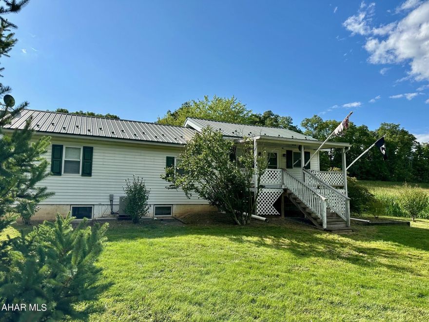 Country living, 3 bedroom home sits on .94 acres. Features large kitchen with hickory cabinets and cathedral ceiling. main floor laundry with separate shower. Detached large 3 car garage and 2 electric garage door openers. A pavilion for entertaining and a orchard full of fruit trees. Shed/ 1 car garage with electric.