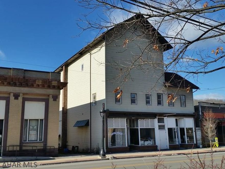 Originally the Opera House. Now 4-Unit apartment building + 2 commercial storefronts New recent Improvements to 1st-floor Storefront units. Roof is 8 -yr-old architectural shingles and there's maintenance free vinyl siding! Off-street parking in back. 3rd floor was previously used as a large ballroom but also has many possibilities. Tenants pay their own heat & electric. (Seller pays trash $40/mo + approx $75.00/month per unit=$375 for water & sewer). Good income + Lots of potential. Use both storefronts for your business or rent out for more income..(4 apartments on 2nd floor were rented for $1,900-#4 $500 just moved=$1,400 current rent) Great location in downtown Coalport-10 minutes to Glendale Lake for fun fishing & boating. Approx 7 miles to Rock Run Recreational ATV trails. J415