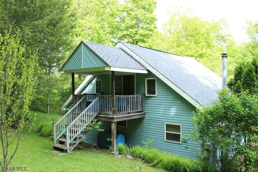 Looking for that serene, enchanted location where you can get away from it all? This is it! One-of-a-kind cottage set in a private wooded setting with 10.45 acres. Close to all the essentials but you'll feel a million miles away. With a screened in porch and two decks, you will find no shortage of places to enjoy your surroundings. And if you just can't get enough nature from the deck, Shawnee State Park is only 3 miles down the road. The master bedroom has its own private deck, great for your morning cup of coffee. All this home needs is you! Call today to take a look.