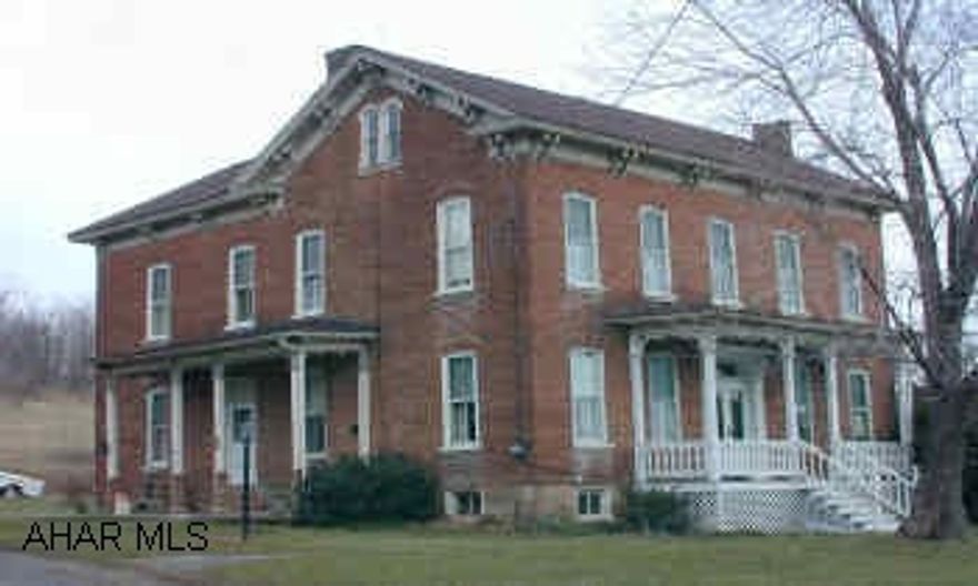 Two story historic brick home on 20 acres.