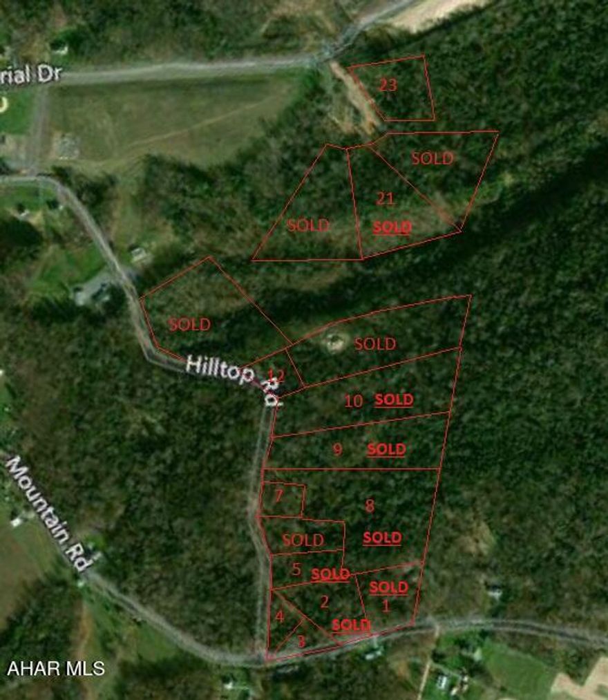 Wooded building lot with a sewer lateral to lot line.  Electric along Mountain Road.  Buyer to drill well. {City water line is a distance away but there is a possibility to extend it to lot at Buyer's expense).  Buyer is also responsible for any and all  extensions/connections to any utility, storm water management the obtaining of driveway and other municipal/state permits.  One of the owners is related to a licensed real estate agent(s).   Taxes to be assessed at time of sale.  lot borders Mountain Road.