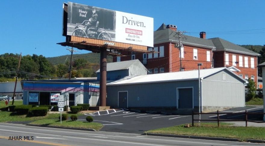 Spacious 6700 Sq. Ft. building with showroom and loading dock/warehouse; the owner will rent or sell building; very visible location- great traffic count. $3500 per year sign rent paid to seller...Approx. 12 years remaining.