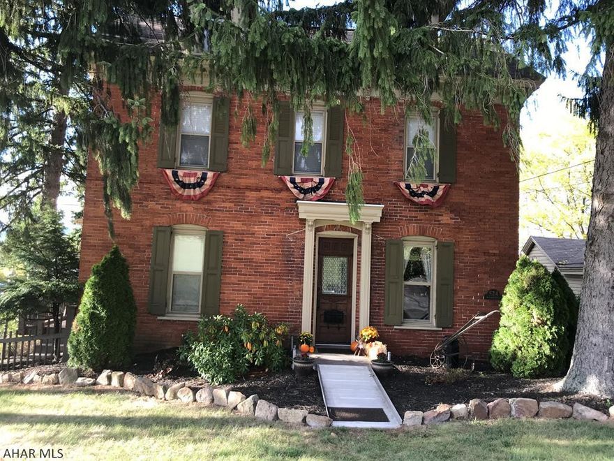 This Victorian brick home is full of classic charm and features renovated kitchen and baths  There's a first floor laundry room/mudroom with an exit to a fenced courtyard. The pellet stove in the living room supplements the heat.  You'll have a first floor office nook or homework area.  Beautiful refinished wood floors. The gas hot water heating system has Glycol in the pipes instead of water to avoid freezing pipes.  One car detached garage with circular driveway. There's plenty of room for outdoor entertaining on more than 3/4 acre lot with a fire pit.  No sign yet.