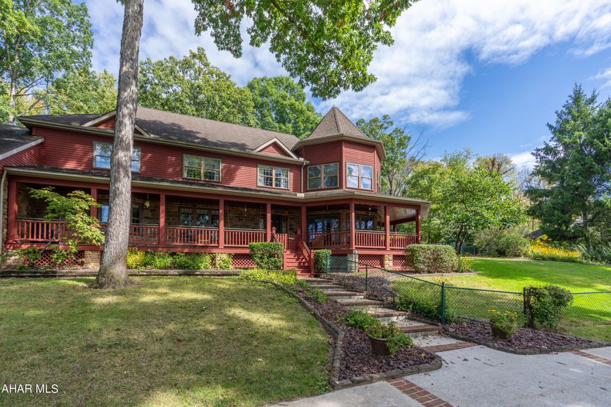 Location, Location, Location!! 
This small country estate is a one of a kind opportunity in Hollidaysburg and offers a Custom Built 2 story Redwood Home with wrap around porch, hardwood floors through out the first and second floors, in ground kidney shaped pool with bath house, gazebo and a detached 1 bedroom stone cottage that can be a mother in law suite or a rental property.   The Brazilian Walnut leaded glass front door welcomes you into the first floor that offers a large open concept kitchen with granite counter tops , architectural designed ceiling, top of the line appliances, walk in pantry and dining area.  Relax and enjoy the elegant living room that is open to the second floor with a gas fireplace that can be enjoyed from both the dining area and living room. Formal dining could be an extra bedroom or den. There is also a first floor bedroom with en suite bathroom, a laundry room and half bath.  The second floor master suite with trayed ceiling and fireplace has a sitting room and separate large his and hers en suite custom bathrooms with walk in closets.  2 bedrooms and a full bath are also on the second floor.
The full finished basement has 2 family rooms and a bathroom.  The over sized 2 car attached garage has a heated concrete floor.  Additional amenities include a sound system through out the house and pool area, security system,  central vac, and fenced dog run.
The quaint stone cottage has been completely remodeled.
Rooms sizes and square footage are approximate and to be verified by buyer.