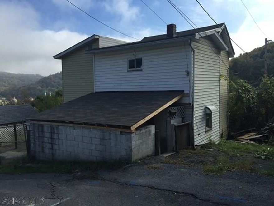 Vinyl 2 story in Johnstown with a fenced yard.  Needs rehab work, but has potential! Sewer lateral line will need to be replaced to meet city requirements.  This property is now under auction terms. Auction dates are (10/17/17-11/17/17). Any presale offers should be submitted to Auction.com. Bids will be taken during pre and post sale at the aforementioned website. No minimum starting bid required. Seller has the right (a) to change the date, place, and terms of the sale; (b) to remove the property from the market; and (c) to sell the property prior to the sale. Please contact Listing Agent for details.