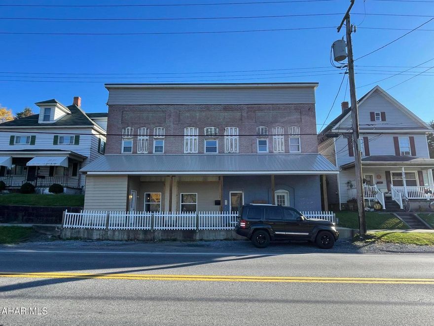 This solid large apartment building is the perfect property to add to your portfolio for the end of 2024! There are 6 residential apartments and 1 commercial store front. All residential units are now rented!  Commercial space was recently used as a yard sale space no current tenant in place.  Each unit has kitchen living area and 1 or 2 bedroom bathroom and laundry.  Rent is below market value. Includes water/sewer/garbage/dumpster in back. Every unit has separate meter, tenants pay electric.  There is plenty of parking out front or in the rear of the building.  Current owner installed the retaining wall to add parking.  Many updates through out since purchased.